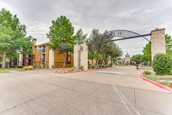 A street view of a residential area with a sign that reads "March".